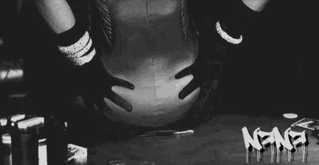 a black and white photo of a woman with the word nana written on the bottom