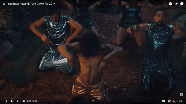two men dancing in front of a thatched hut with a youtube logo in the corner