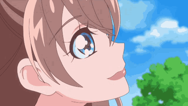 a close up of a girl 's face with a blue sky behind her