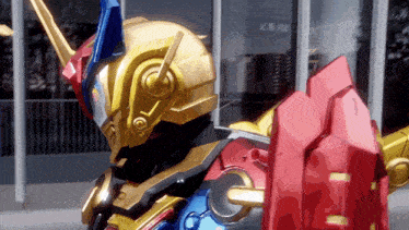 a robot with a helmet and a red shield stands in front of a building