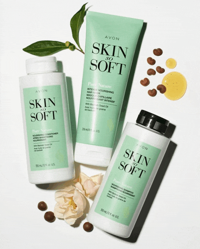 three bottles of avon skin so soft are sitting next to each other