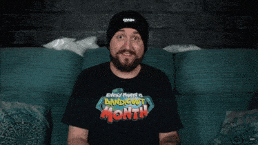 a man wearing a black shirt that says " every month is bandicoot month "