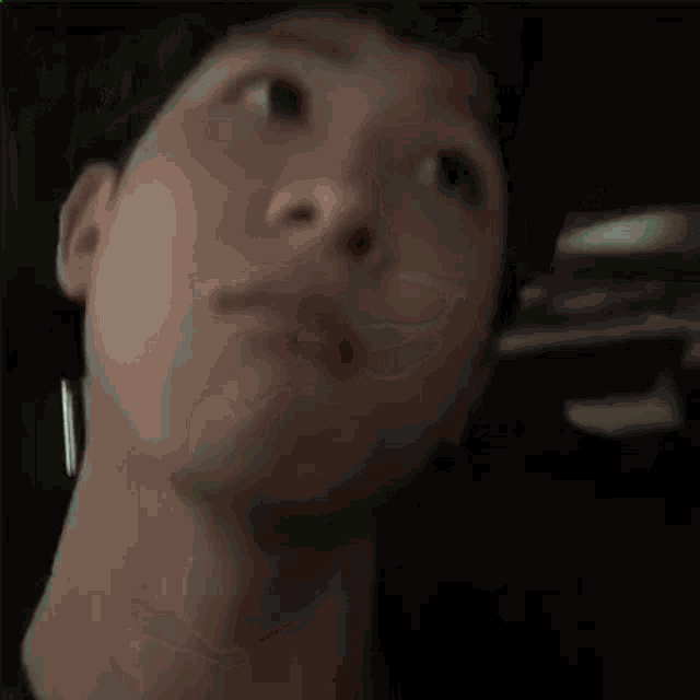 a close up of a person 's face with their eyes closed .