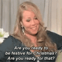 mariah carey is smiling and talking about christmas and ready to be festive for christmas .