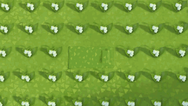 a person in a hat is laying on a mat in a field of white flowers
