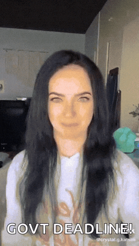 a woman with long black hair says govt deadline on her face