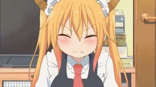 a girl with long hair and horns is wearing a maid outfit and a tie .