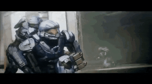 a man in a halo armor is carrying another man