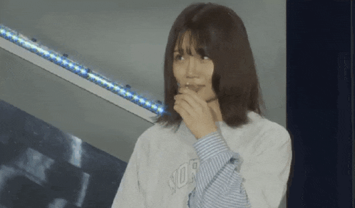 a woman wearing a sweatshirt that says york on it