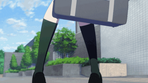 a girl carrying a briefcase walking down a street