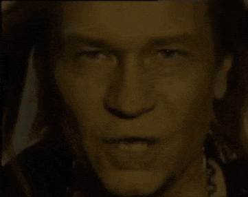 a close up of a man 's face with a smile on it