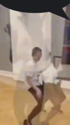 a blurred image of a person standing in a room