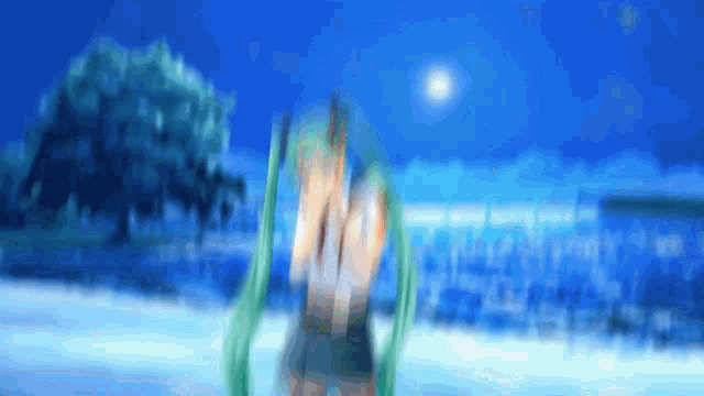 a blurry picture of a person with green hair and a blue sky in the background
