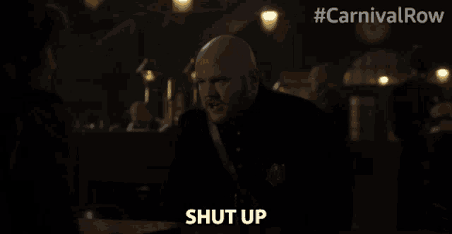 a man says shut up in front of a carnival row logo