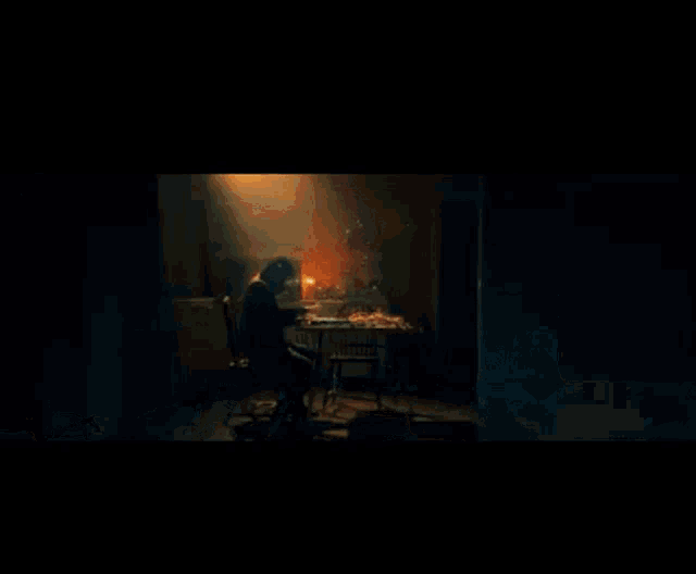 a painting of a person sitting at a table