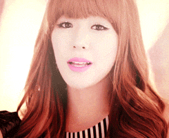 a close up of a woman 's face with pink lips