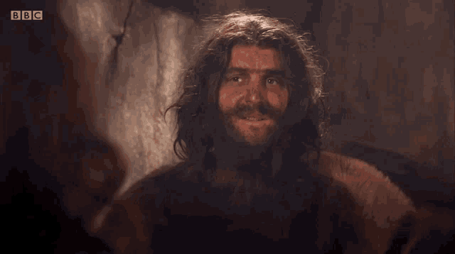 a man with long hair and a beard is on a bbc show