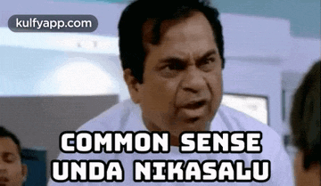 a man in a white shirt is making a funny face and says common sense unda nikasalu .