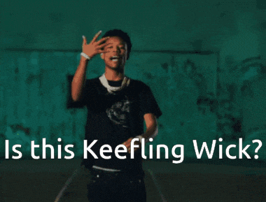 a young man wearing a necklace and a black shirt says is this keelling wick ?