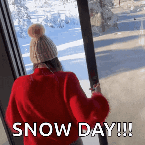 a woman in a red sweater and hat looking out a window with the words snow day written on the bottom