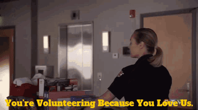 a woman volunteering because she loves us is shown