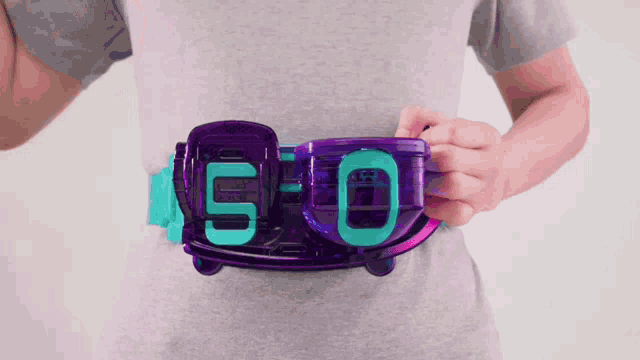 a person is wearing a purple belt with the letters 5 and 0 on it