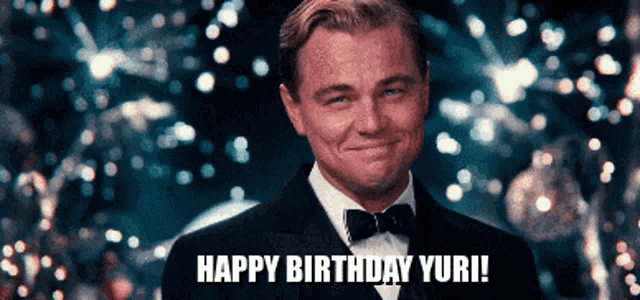 a man in a tuxedo and bow tie says " happy birthday yuri "