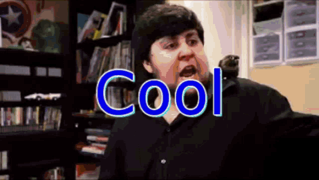 a man in a black shirt is making a funny face with the word cool written above him .