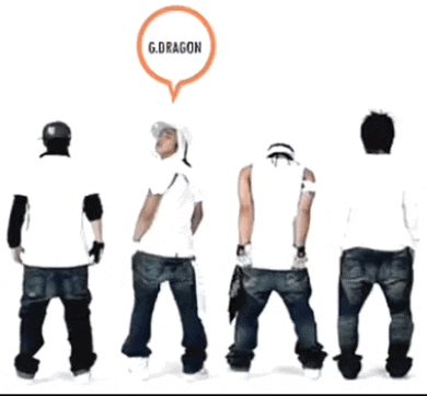 a group of young men are standing in a line with a speech bubble that says g.dragon