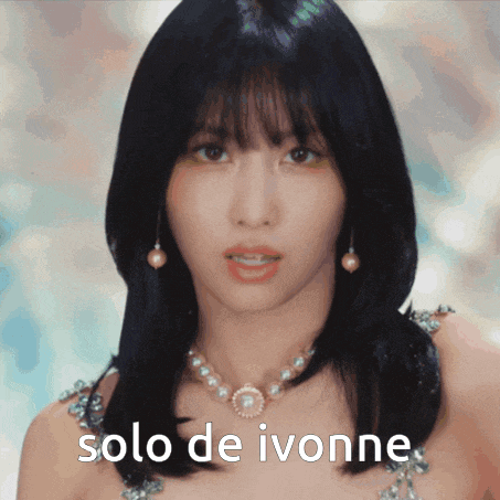 a close up of a woman wearing a pearl necklace and earrings with the words solo de ivonne below her