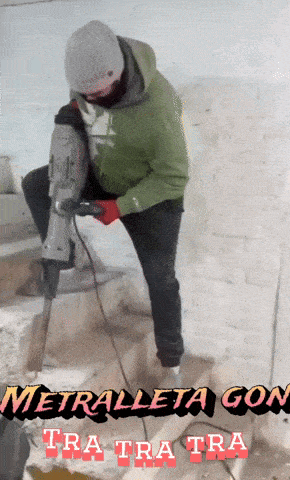 a man in a green hoodie is using a hammer and the words metraleta gon tra tra tra