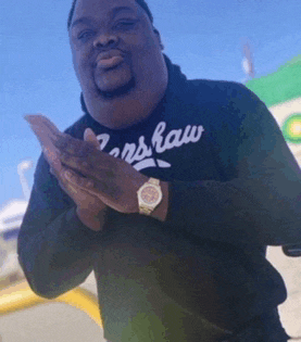 a man wearing a shirt that says ' nslaw ' on it