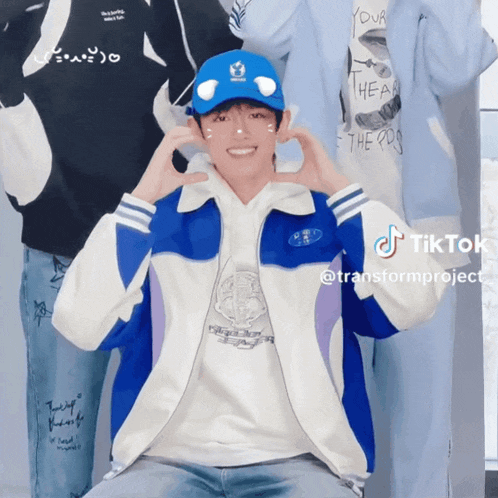 a man wearing a blue hat and a blue jacket has a tiktok account