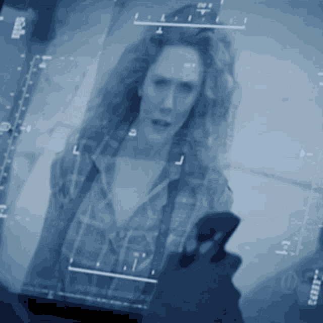 a picture of a woman is displayed on a screen with the letters l and j visible