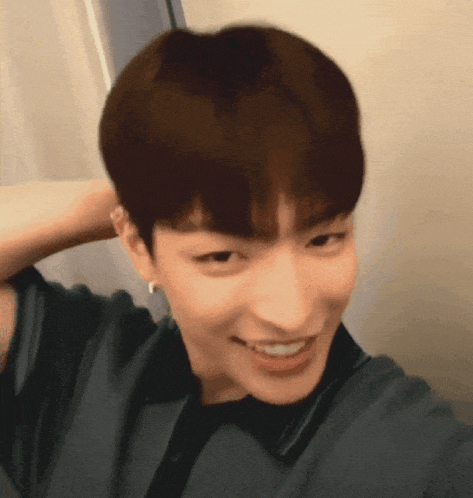 a close up of a young man taking a selfie