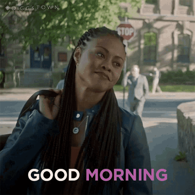 a woman with braids says good morning in pink