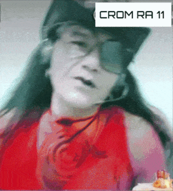 a close up of a woman wearing sunglasses and a hat with the word crom on it