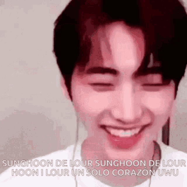 a man is smiling with his eyes closed and the words sunghoon de lour sunghoon de lour