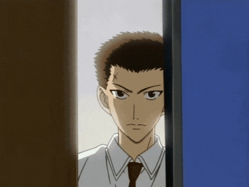 a man in a white shirt and tie is peeking through a doorway