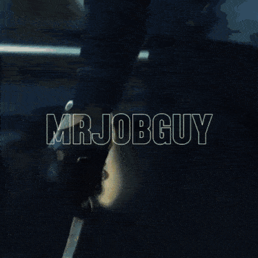 a man wearing sunglasses and a name tag that says mrjobg holds a cup of coffee
