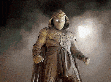 a man in a costume with a mask on his face is standing in the dark