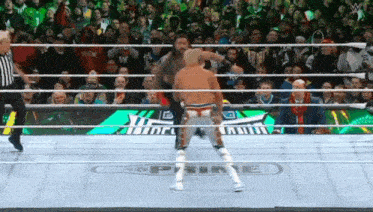 a wrestler in a ring with the word prime on the ground