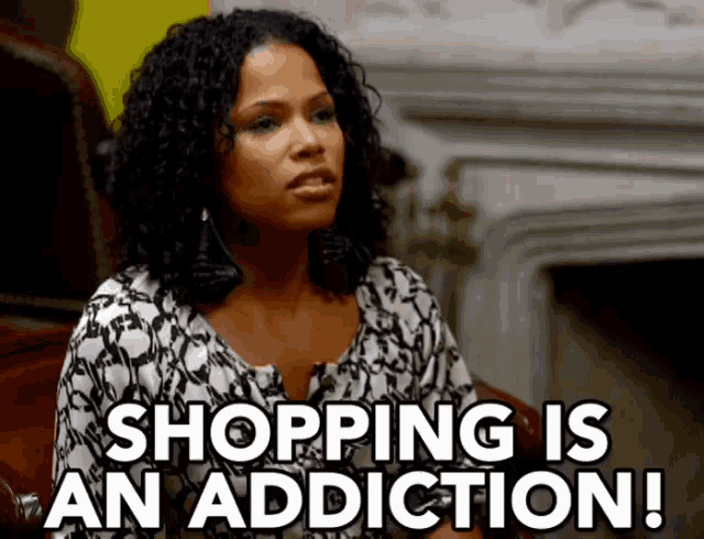 a woman sitting in front of a fireplace with the words shopping is an addiction written below her