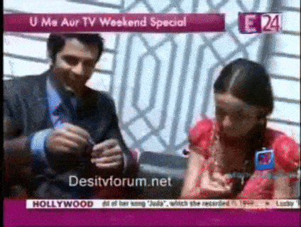 a man and a girl are sitting in front of a screen that says desitvforum.net