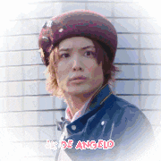 a man wearing a hat and a jacket with the name de angelo written on the bottom