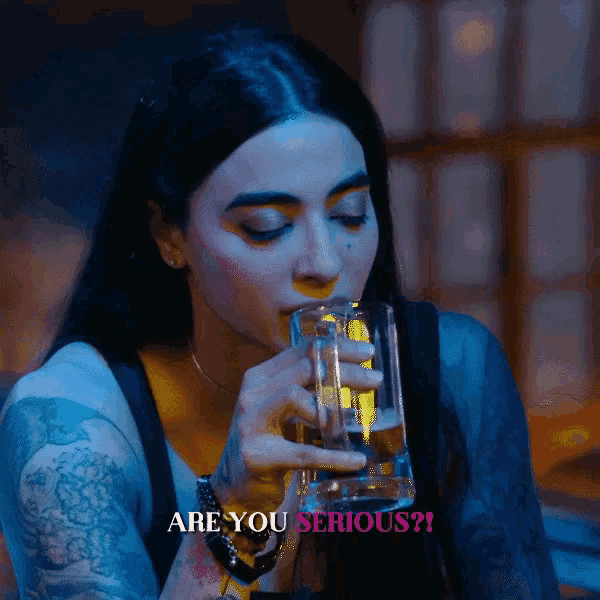 a woman drinking from a glass with the words " are you serious " above her