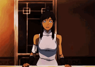 a woman in a white dress is standing at a table with her eyes closed .
