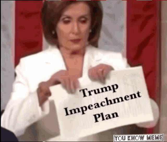 a woman is holding a piece of paper that reads trump impeachment plan