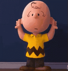 charlie brown from the peanuts movie is standing with his arms outstretched .