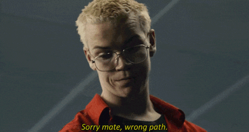 a man in a red shirt and glasses says sorry mate wrong path